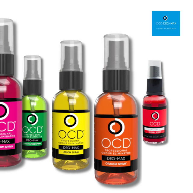 Collection of OCD Deo-Max spray bottles in various colors on a white background